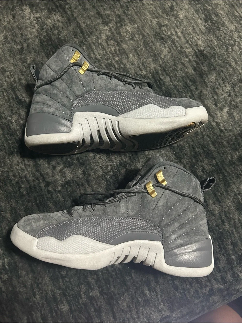 Jordan 12s Retro High Top Sneakers in Gray with Gold Accents